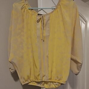 Express Yellow Blouse with Subtle Patterns